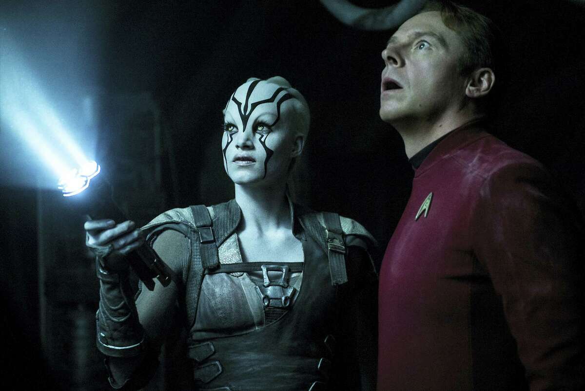 In this image provided by Paramount Pictures, Sofia Boutella, left, plays Jaylah and Simon Pegg plays Scotty in Star Trek Beyond. “Star Trek Beyond” has landed atop the weekend box office. According to studio estimates Sunday, July 24, 2016, the latest outing for the Starship Enterprise soared to $59.6 million in North American ticket sales, knocking “The Secret Life of Pets” from the No. 1 spot.