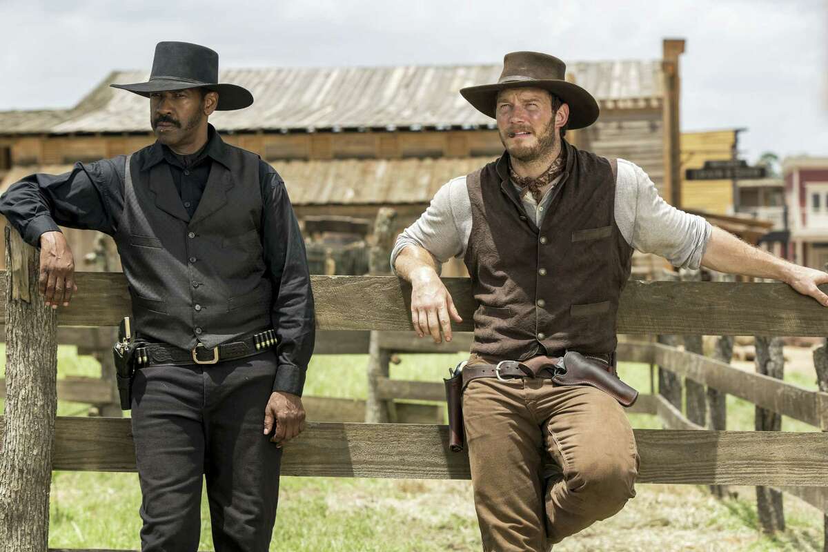 In this image released by Sony Pictures, Chris Pratt, right, and Denzel Washington appear in a scene from “The Magnificent Seven.” Antoine Fuqua’s “The Magnificent Seven” remake rode the star power of Denzel Washington to an estimated $35 million debut, topping North American ticket sales over the weekend.