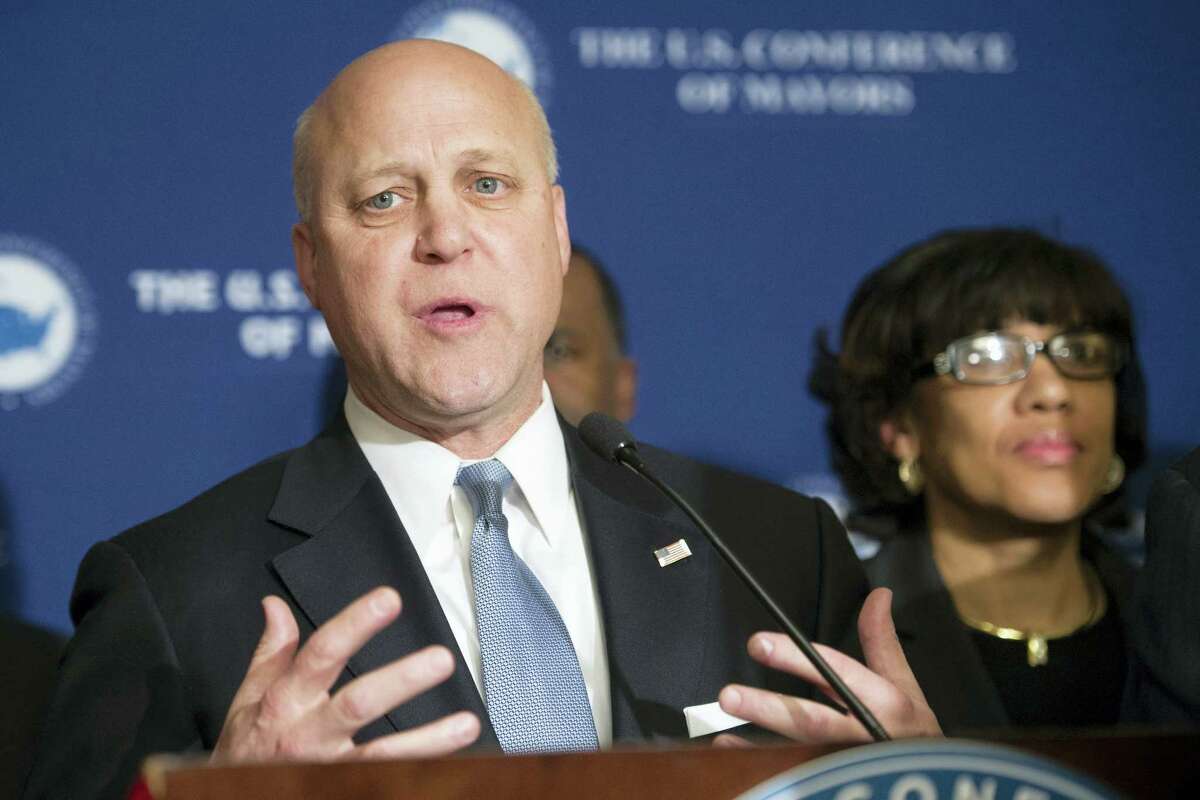 New Orleans Mayor Mitch Landrieu speaks at a news conference during the U.S. Conference of Mayors Winter Meeting in Washington, Wednesday, Jan. 20, 2016. Flint, Mich., Mayor Karen Weaver is at right.