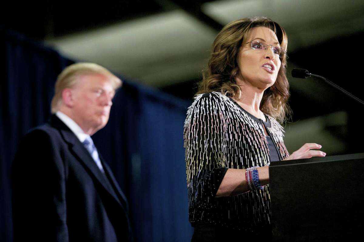 Former Alaska Gov. Sarah Palin, right, endorses Republican presidential candidate Donald Trump during a rally at the Iowa State University on Jan. 19, 2016 in Ames, Iowa.
