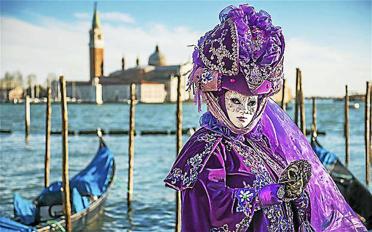 A woman wears a traditional “Carnevale” costume in Venice, Italy.