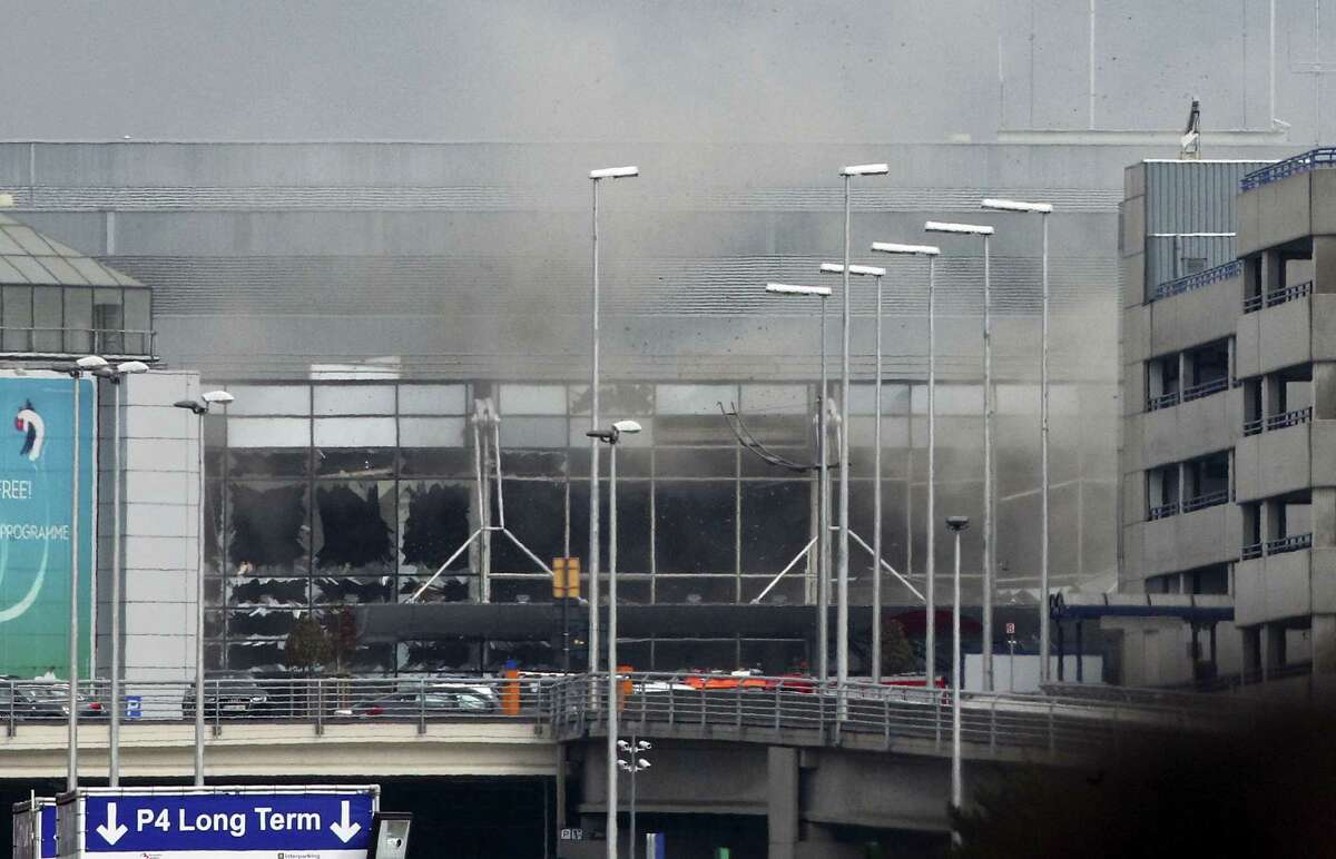 Smoke billows from the Zaventem Airport after a controlled explosion in Brussels, Tuesday, March 22, 2016. Bombs struck the Brussels airport and one of the city’s metro stations Tuesday, killing and wounding dozens of people, as a European capital was again locked down amid heightened security threats.