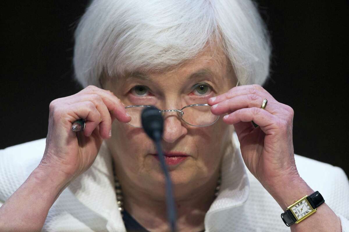 Federal Reserve Chairman Janet Yellen adjusts her glasses as she testifies on Capitol Hill in Washington, D.C., in June.