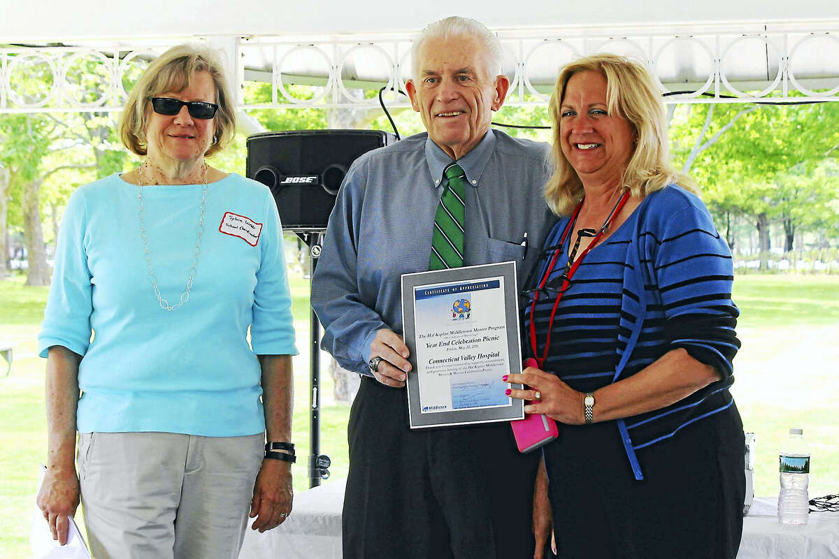The Hal Kaplan Middletown Mentor Program held its end-of-the-year celebration picnic on the grounds of Connecticut Valley Hospital, where mentors connected with their mentee over lunch and during activities. From left are schools mentor coordinator Sylvia Webb, Middlesex County Chamber of Commerce President Larry McHugh and Chief Operating Officer of Connecticut Valley Hospital Helene Vartelas.