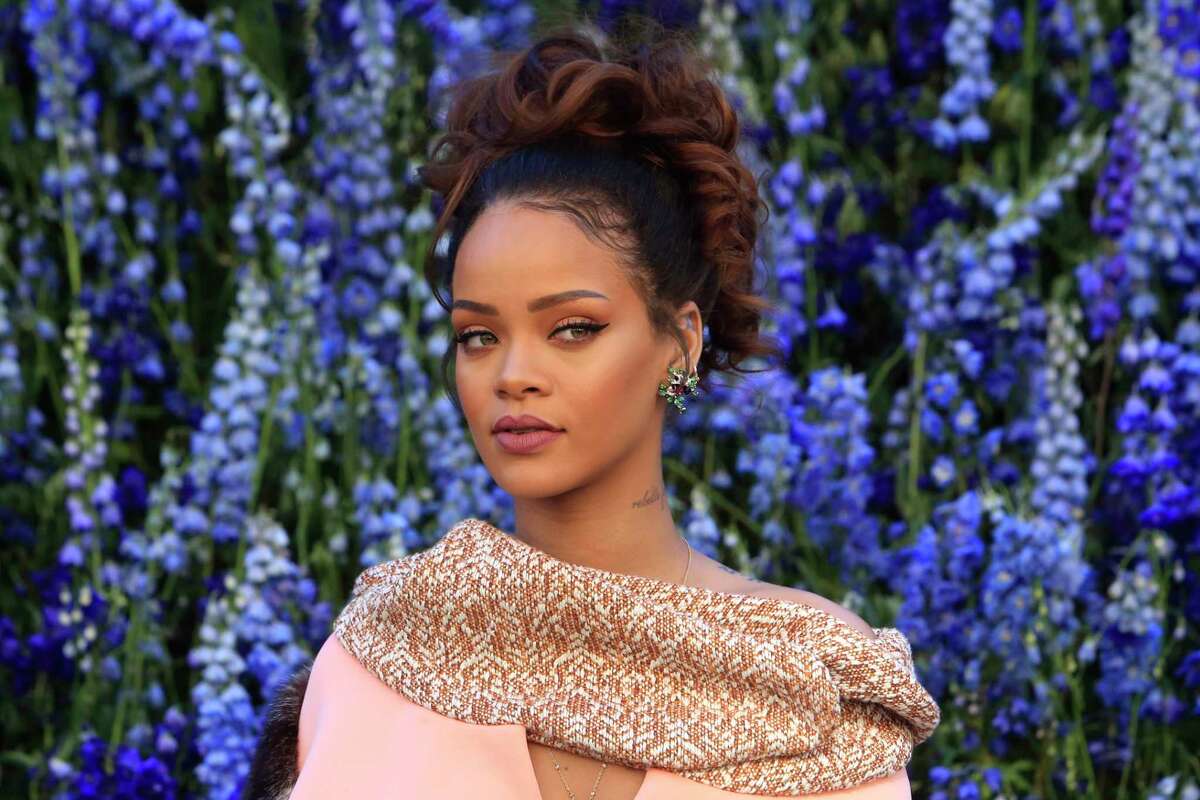 In this Oct. 2, 2015 photo, singer Rihanna poses before Christian Dior’s Spring-Summer 2016 ready-to-wear fashion collection to be presented during the Paris Fashion Week in Paris.