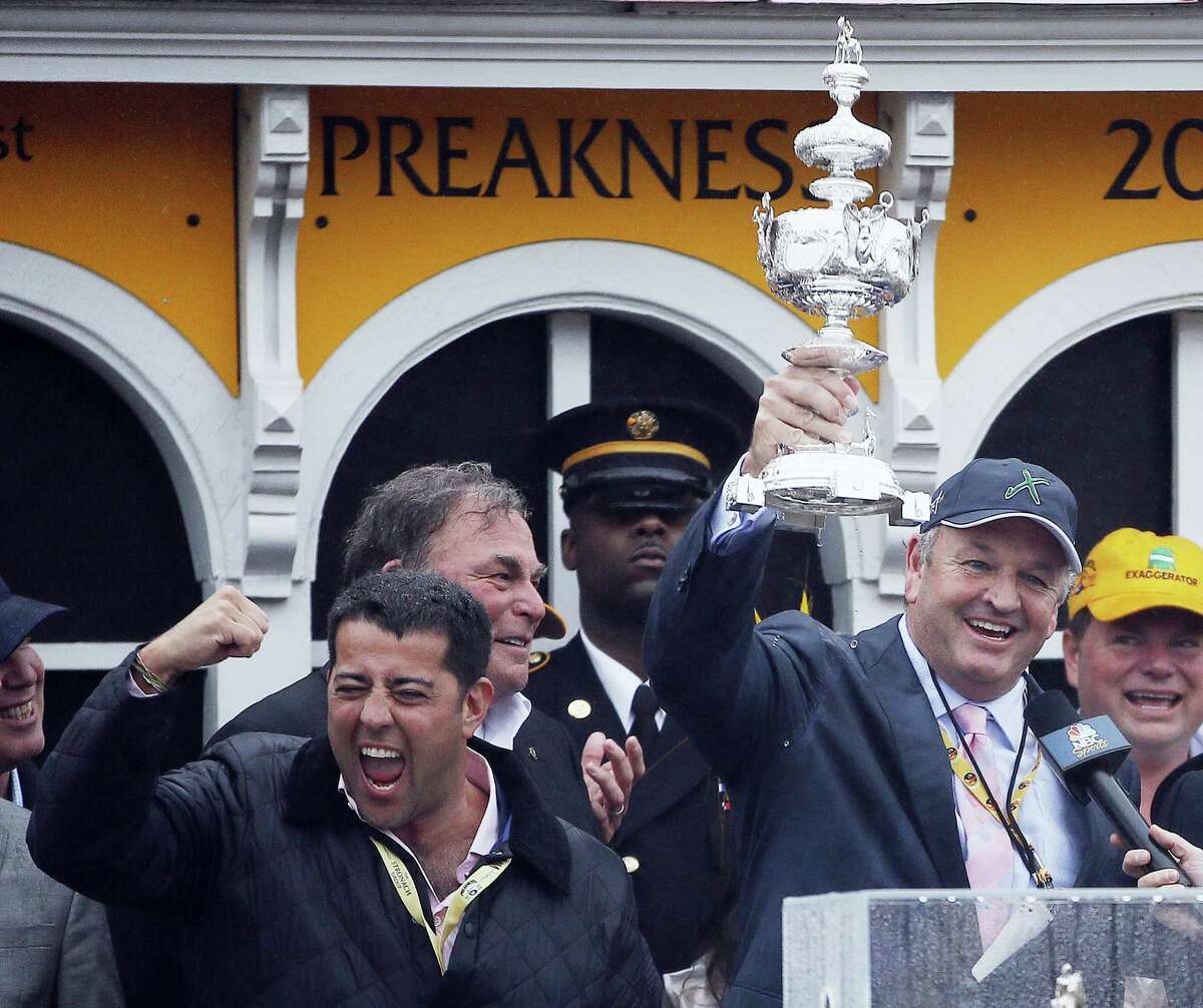 Principal partner of Big Chief Racing Matt Bryan, right, celebrates with other team members after Exaggerator won the Preakness Stakes.