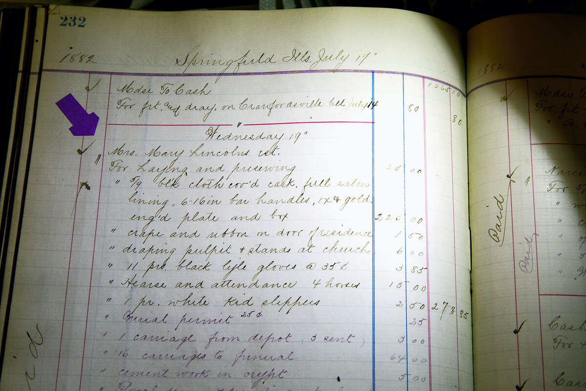 This May 18, 2016, photo shows an itemized list of expenses believed to be from the 1882 funeral of Mary Todd Lincoln at the Boardman-Smith Funeral Home in Springfield, Ill. The list was included in stacks of fragile ledgers acquired by Butler Funeral Homes of Springfield through the buyout last year of Boardman-Smith Funeral Home. Butler Funeral Homes is creating a “Lincoln Room” where the Mary Lincoln Todd ledger entry will be displayed with other documents tied to Springfield’s funeral history.
