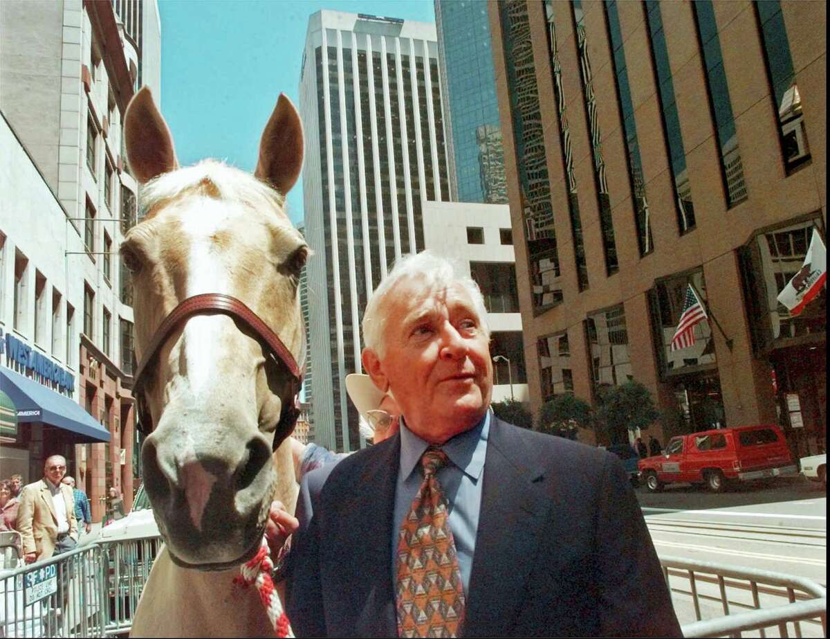 In this July 31, 1997 file photo, actor Alan Young of the “Mister Ed” television series, poses with Mister Ed-For-A-Day, “Champagne,” a 13-year-old Palomino mare, in San Francisco. Young, who played straight man to the talking horse in the 1960s sitcom, has died. Jaime Larkin, a spokeswoman for the Motion Picture and Television Home in Los Angeles, says that Young died Thursday, May 19, 2016. He was 96.
