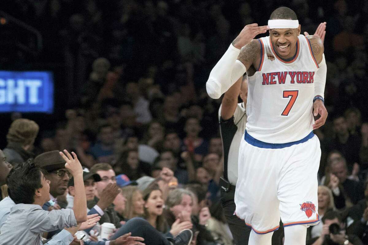 New York Knicks forward Carmelo Anthony reacts after scoring a 3-point goal during the second half of an NBA basketball game against the Atlanta Hawks, Sunday, Nov. 20, 2016, at Madison Square Garden in New York. The Knicks won 104-94. (AP Photo/Mary Altaffer)