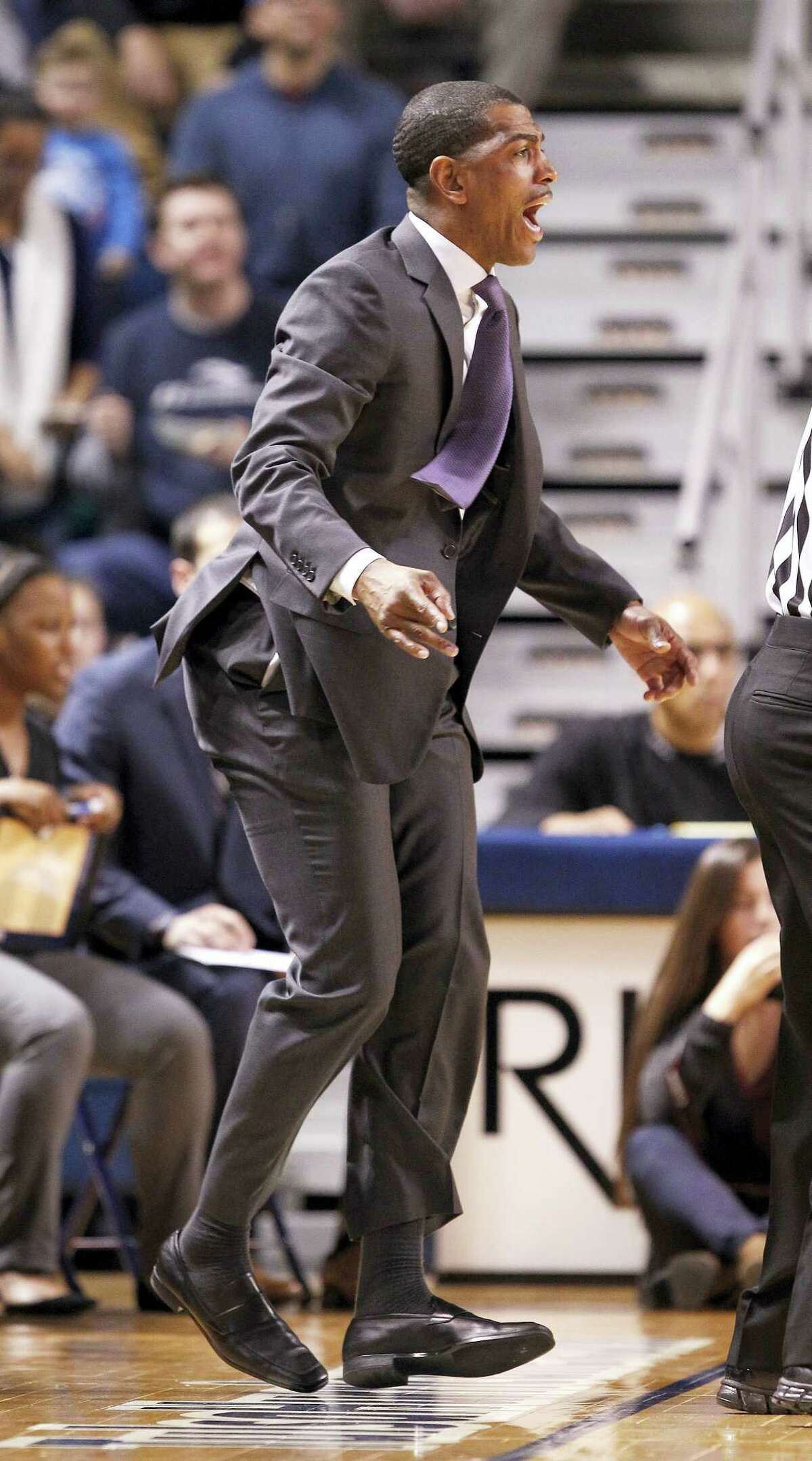 Connecticut head coach Kevin Ollie shouts instructions to his team during the first half of an NCAA college basketball game against Tulsa in Tulsa, Okla., Thursday, Jan. 14, 2016. (AP Photo/Dave Crenshaw)