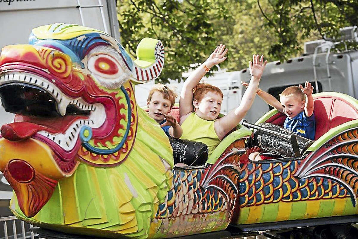 Kids enjoy a ride at a previous version of the Durham Fair.