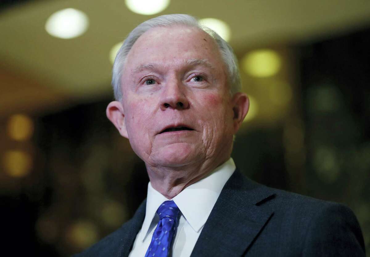 In this photo taken Sen. Jeff Sessions, R-Ala. speaks to media at Trump Tower in New York. President-elect Donald Trump has picked Sessions for the job of attorney general.