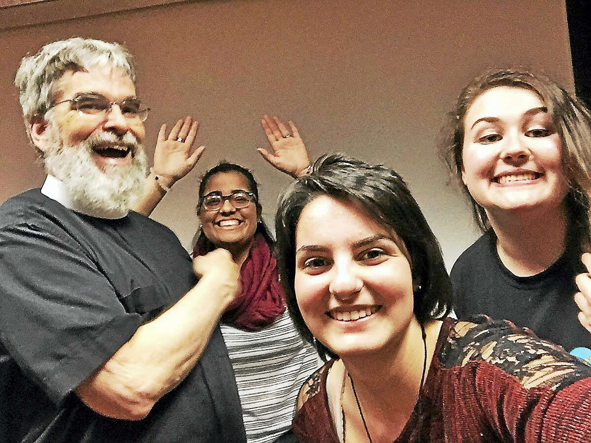 Brother Guy Consolmagno poses for a selfie with Mercy High School students Maria Socarras (background,) Michelle Orlando and Emily Tyler.