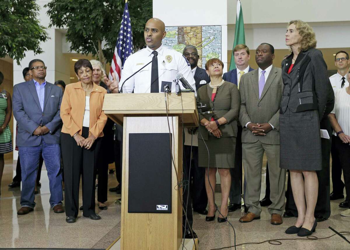 Charlotte-Mecklenburg Police Chief Kerr Putney speaks as city officials, including Charlotte mayor Jennifer Roberts, right, listen during a news conference after a second night of violence following Tuesday’s fatal police shooting of Keith Lamont Scott in Charlotte, N.C. Thursday, Sept. 22, 2016.