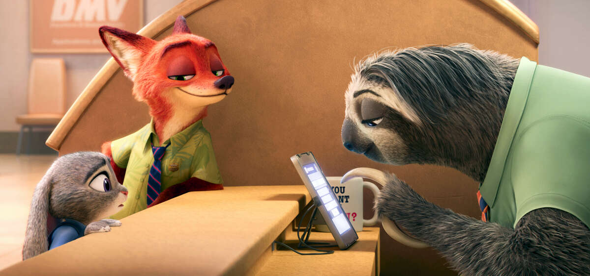 This image released by Disney shows Judy Hopps, voiced by Ginnifer Goodwin, left, Nick Wilde, voiced by Jason Bateman, second left, in a scene from the animated film, “Zootopia.”