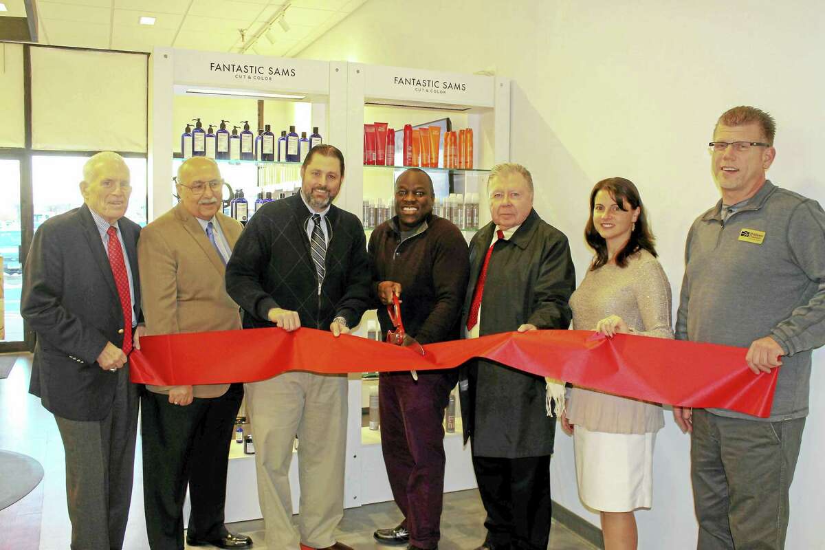 Fantastic Sams at 51 Shunpike Road in Cromwell held a grand opening recently. From left are: Middlesex Chamber President Larry McHugh, Cromwell Town Manager Anthony J. Salvatore, Mayor Enzo Faienza, Fantastic Sams owner Jay Oboma, chamber Cromwell Division chair Jay Polke, state Rep. Christie Carpino, and Cromwell Downtown Merchants Association co-chair Rodney Bitgood.