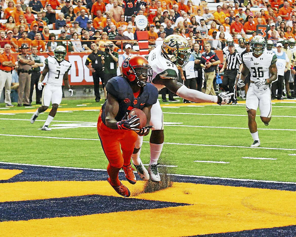 Syracuse’s Ervin Philips catches a touchdown pass against South Florida. The former West Haven star is third in the FBS with 30 receptions.