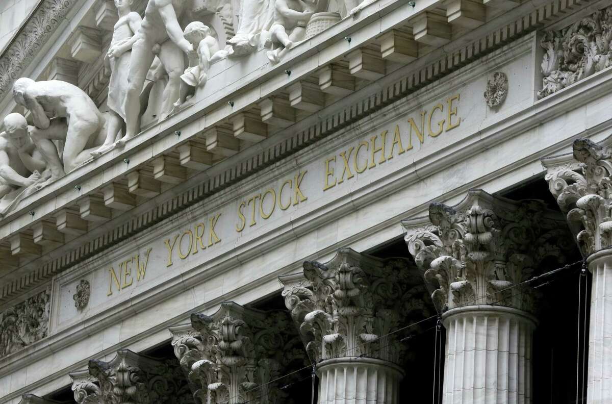 FILE - This Oct. 2, 2014, file photo shows the facade of the New York Stock Exchange. Global stock markets recovered their poise Friday, May 20, 2016, in the wake of sizeable falls triggered by the U.S. Federal Reserve's surprise indication that it could raise interest rates in June.