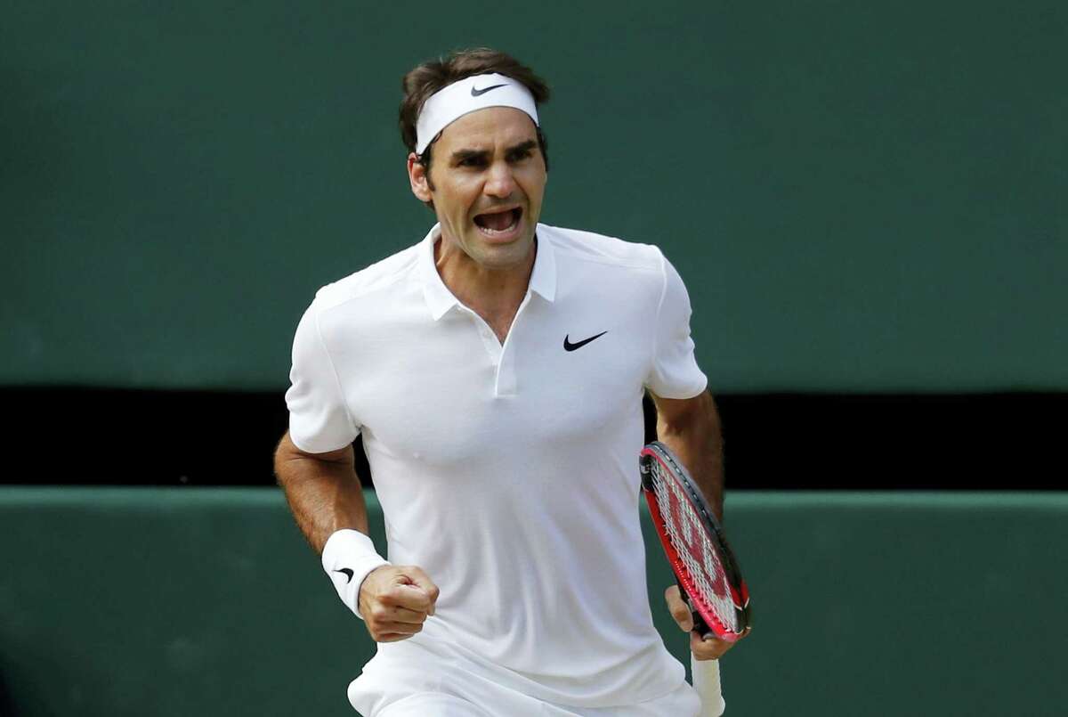 Roger Federer of Switzerland celebrates a point against Marin Cilic of Croatia during their men’s singles match on day ten of the Wimbledon Tennis Championships in London on July 6, 2016.