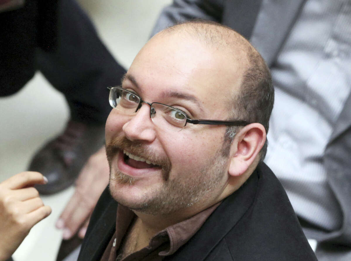 In this photo April 11, 2013 file photo, Jason Rezaian, an Iranian-American correspondent for the Washington Post, smiles as he attends a presidential campaign of President Hassan Rouhani in Tehran, Iran. A source close to Iran’s judiciary confirmed to The Associated Press, Saturday, Jan. 16, 2016 that jailed Washington Post bureau chief Jason Rezaian is one of four dual-national prisoners freed by Iran’s government and previously announced on Iranian state television without naming those released.