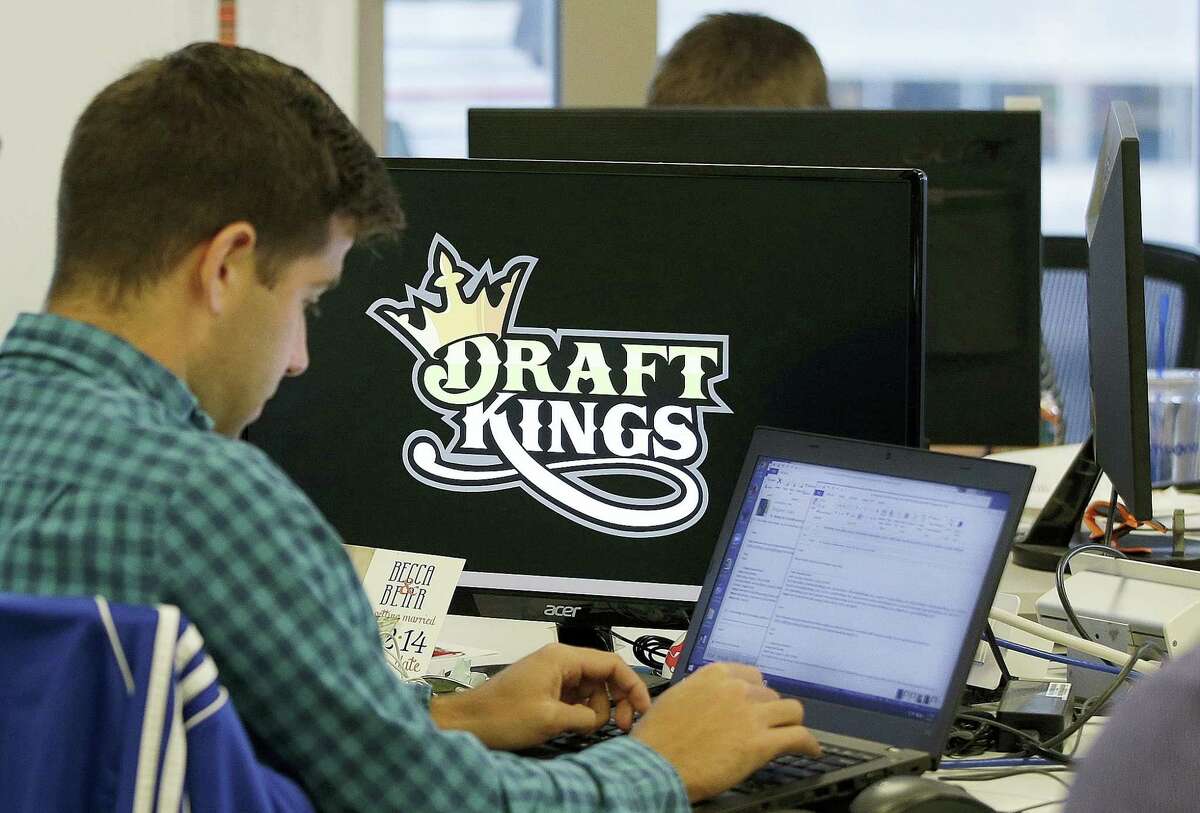 Bear Duker, a marketing manager for strategic partnerships at DraftKings, works at his computer at the company headquarters in Boston.