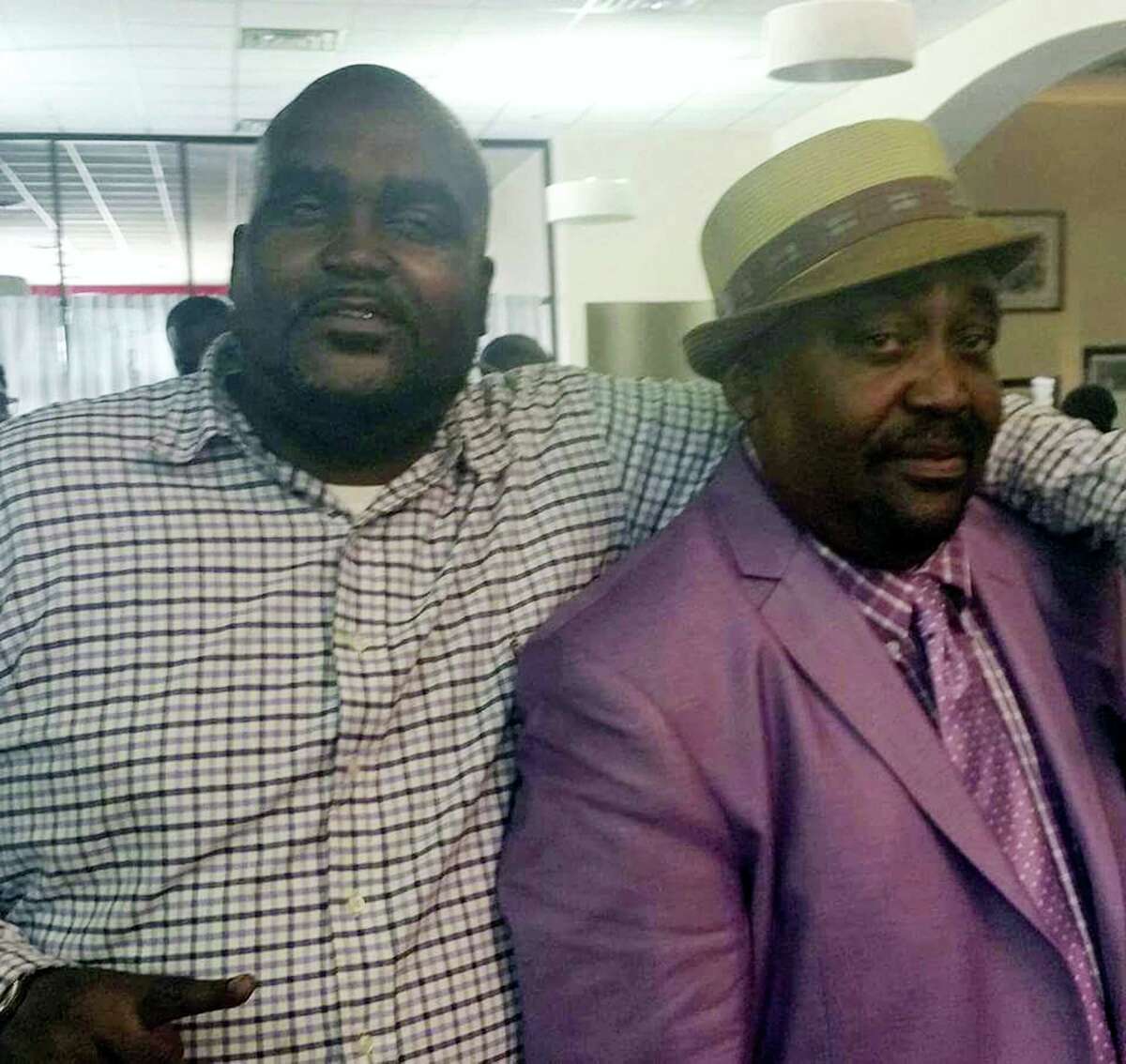 This undated photo provided by the Parks & Crump, LLC shows Terence Crutcher, left, with his father, Joey Crutcher. Crutcher, an unarmed black man, was killed by a white Oklahoma officer on Sept. 16, 2016 who was responding to a stalled vehicle.
