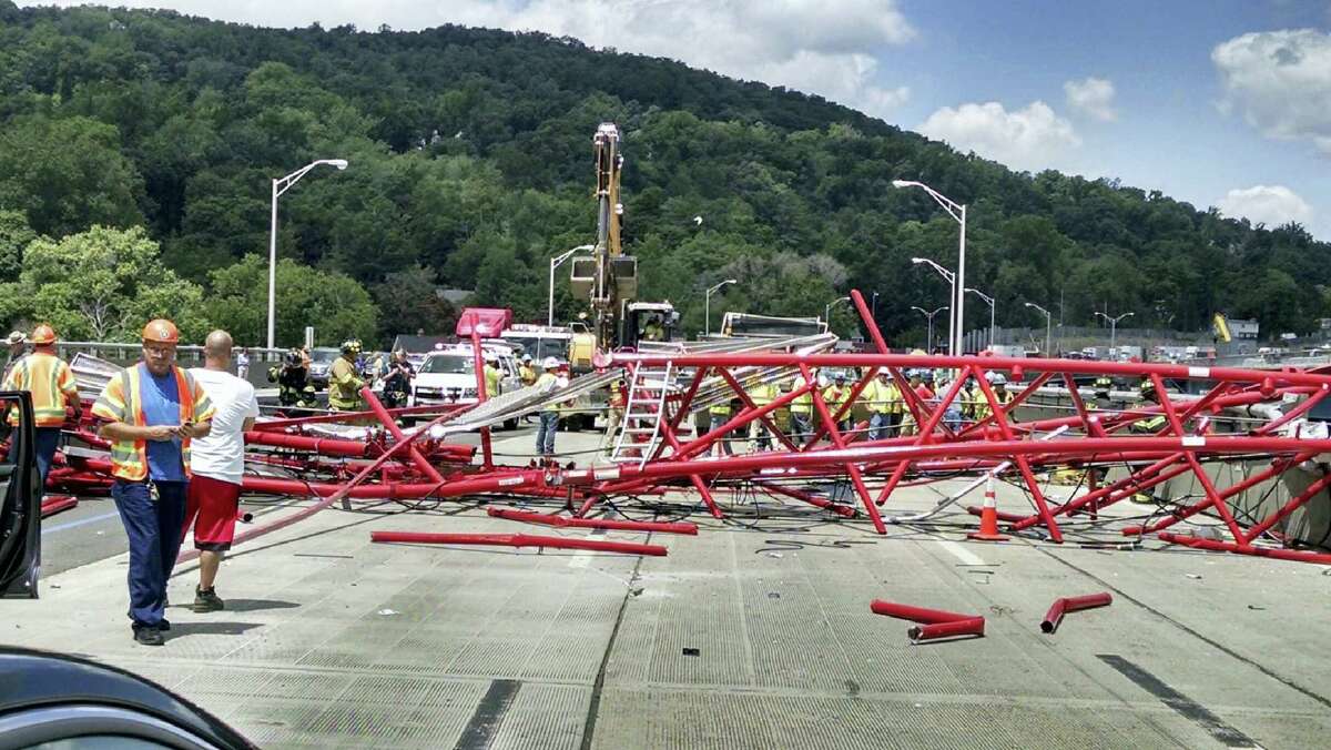 A giant crane sits road bed of the Tappan Zee Bridge north of New York City after toppling around noon Tuesday during construction of a new bridge, across the Hudson River between Westchester and Rockland counties.
