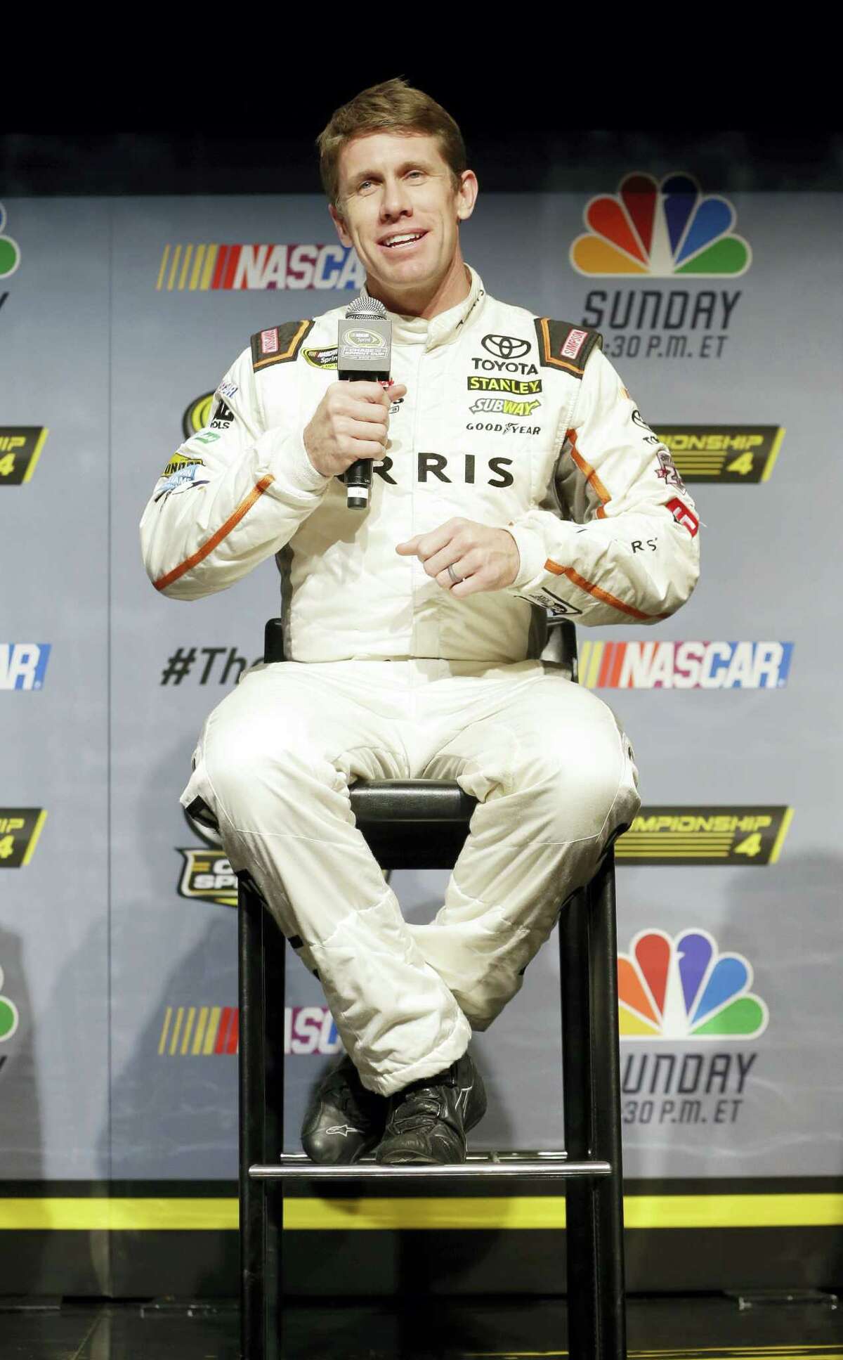 Carl Edwards answers a question during a news conference Thursday in Miami Beach, Fla.