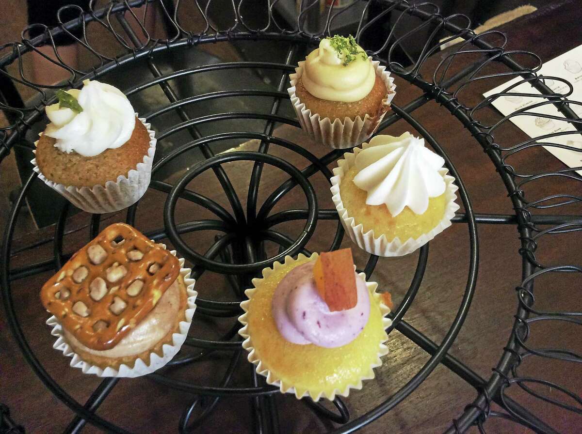 A selection of cupcakes from Prohibition Bakery, clockwise from top right, Dark & Stormy, Birthday Cake, Basic Bitch, Pretzels & Beer and Mint Julep.