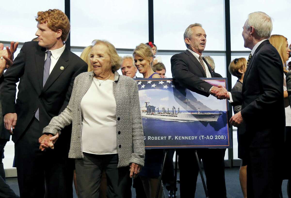 Ethel Kennedy, widow of Sen. Robert F. Kennedy, holds hands with grandson Joseph P. Kennedy III, left, while Robert F. Kennedy Jr. shakes hands with Navy Secretary Ray Mabus, right, as they gather with family members to pose near a rendering of the Robert F. Kennedy Navy Ship named at the John F. Kennedy Presidential Library, Tuesday, Sept. 20, 2016, in Boston. The new ship’s job will be to restock and refuel other ships already at sea. Ships in this class are being named in honor of civil and human rights heroes.