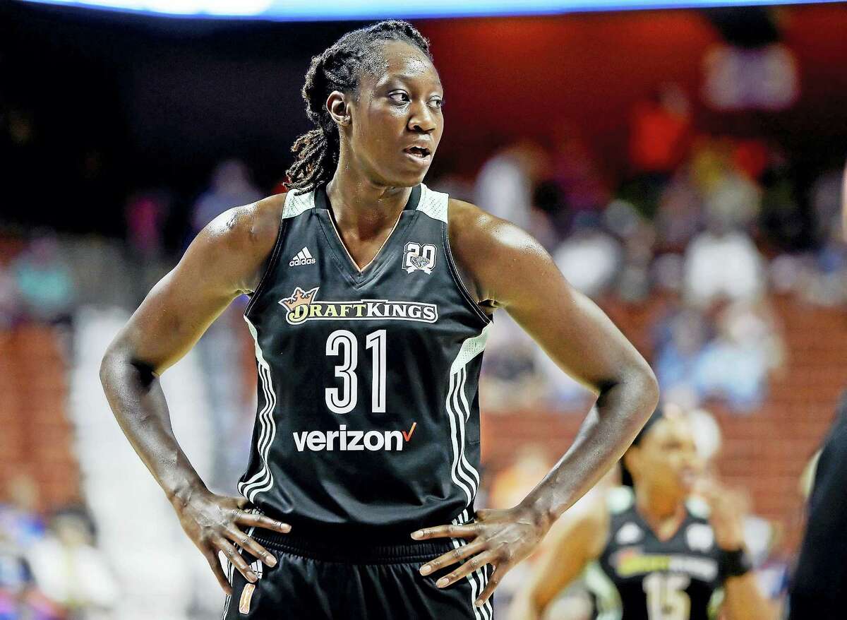 Former UConn star Tina Charles became just the second player in WNBA history to win the scoring and rebounding titles in the same season.