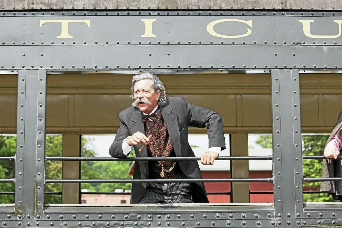 Contributed photos - Essex Steam Train & Riverboat Connecticut's famous author Mark Twain, portrayed by actor John Pogson, will ride the Essex Steam Train in June, greeting passengers and guests.