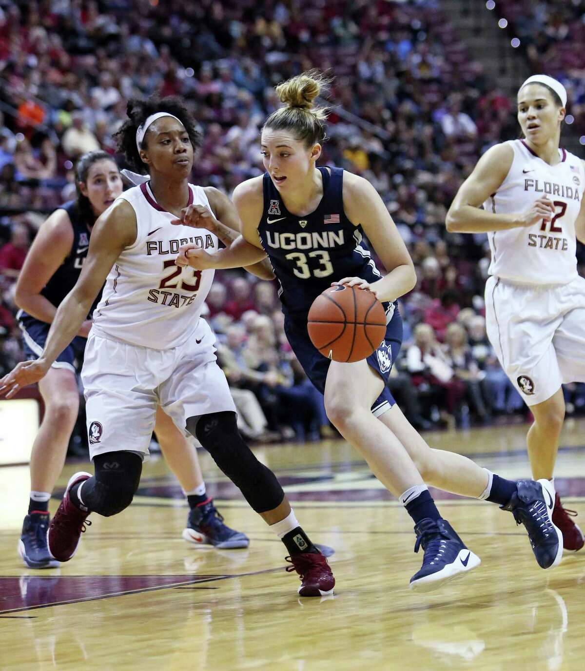 Connecticut’s Katie Lou drives the basketball up court as Florida State’s Ivey Slaughter defends in the second quarter of an NCAA college basketball game, Monday, Nov. 14, 2016, in Tallahassee, Fla. UConn won the game 78-76. (AP Photo/Steve Cannon)