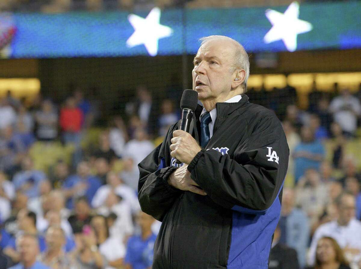 In this Sept. 18, 2015 photo, Frank Sinatra, Jr. sings the national anthem prior to a baseball game between the Los Angeles Dodgers and the Pittsburgh Pirates in Los Angeles. Sinatra Jr., who carried on his famous father’s legacy with his own music career, has died. He was 72.
