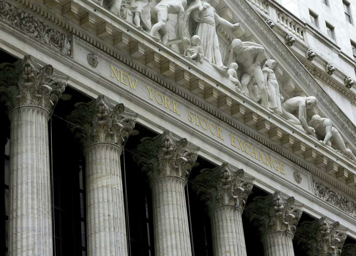FILE - This Thursday, Oct. 2, 2014, file photo, shows the facade of the New York Stock Exchange. U.S. stocks moved little in early trading Thursday, March 17, 2016, as investors weighed a report on unemployment benefits and corporate news.