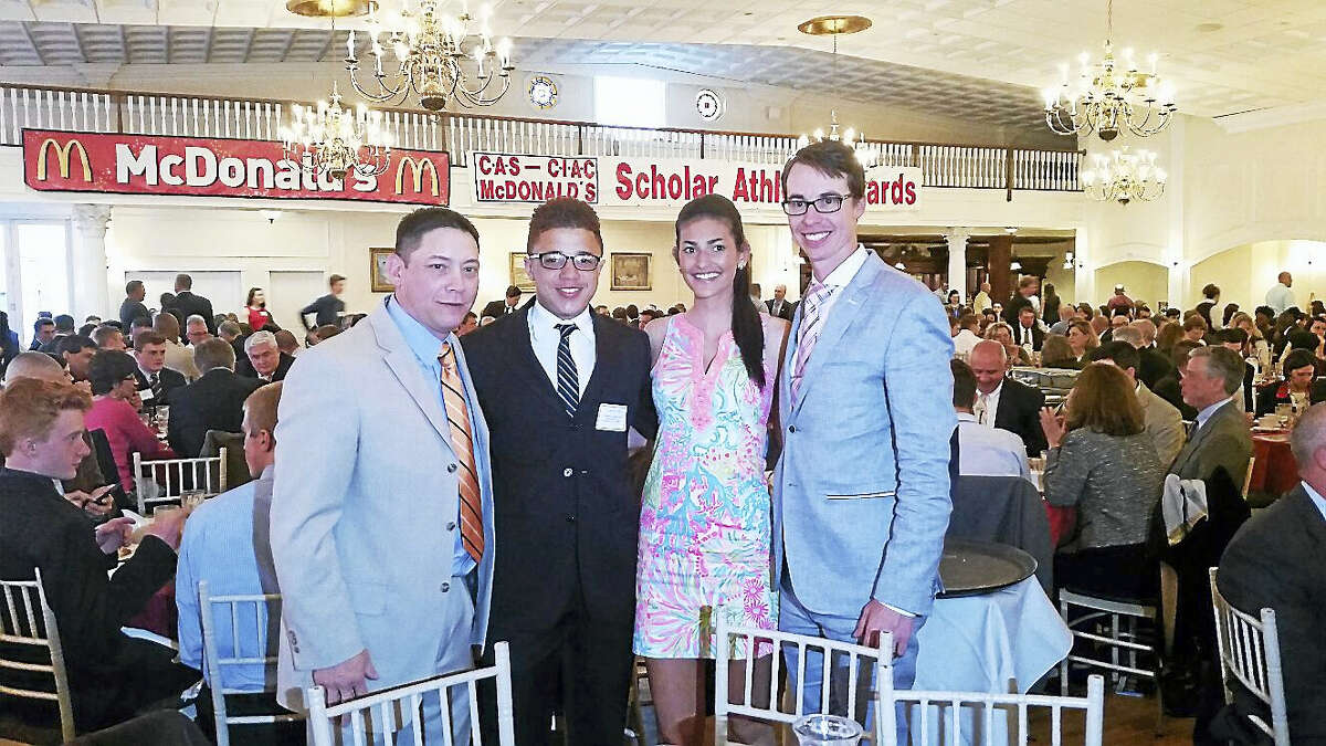 From left are: Middletown High wrestling coach Mark Fong, CIAC Scholar-Athletes Andre Rogers and Alexandra DeFrance and Ultimate Frisbee coach Trevor Charles at the CIAC Scholar Athlete Awards dinner at the Aqua Turf Club in Southington.