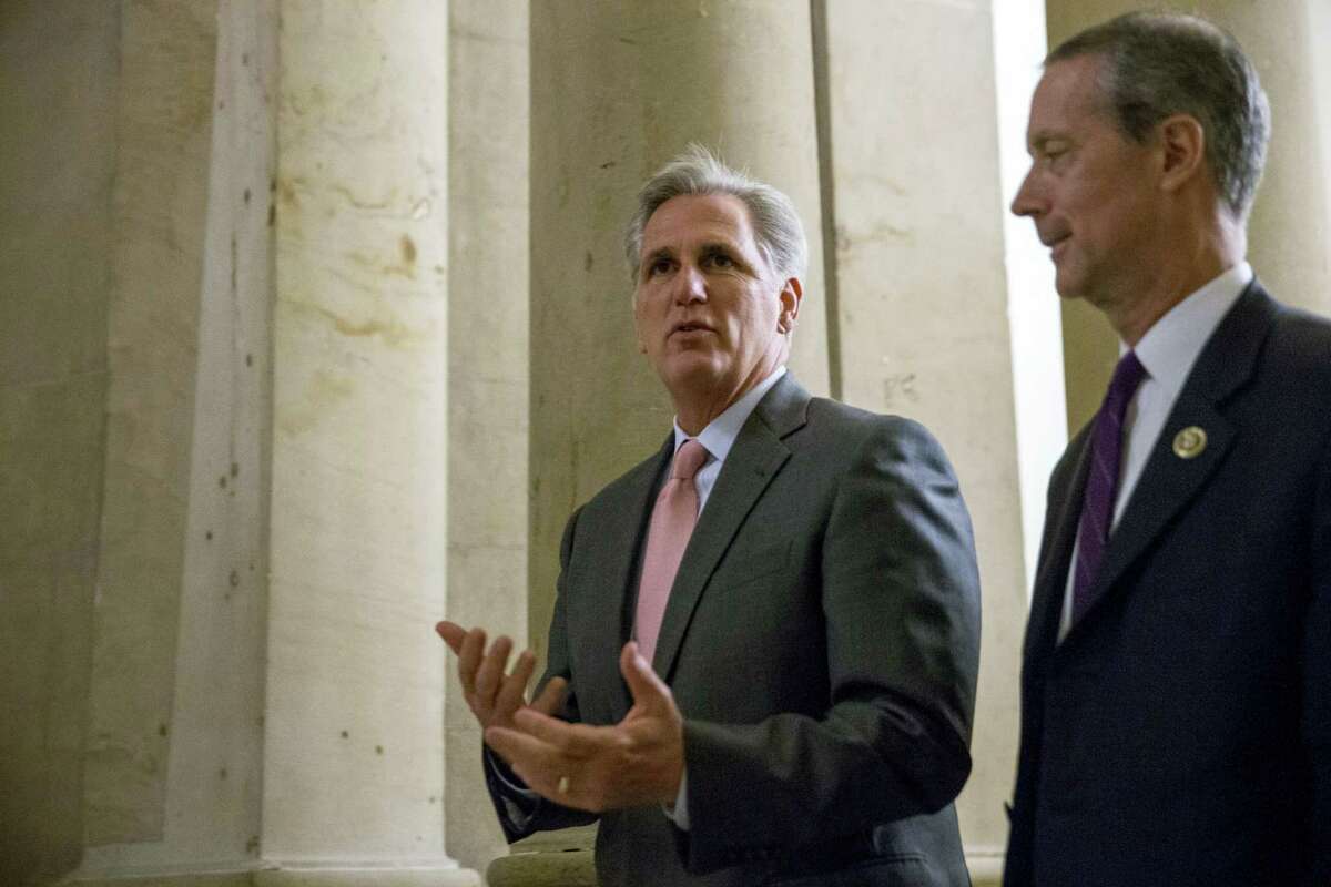 House Majority Leader Kevin McCarthy of California, center, is accompanied by House Armed Services Committee Chairman Rep. Mac Thornberry, R-Texas, right.