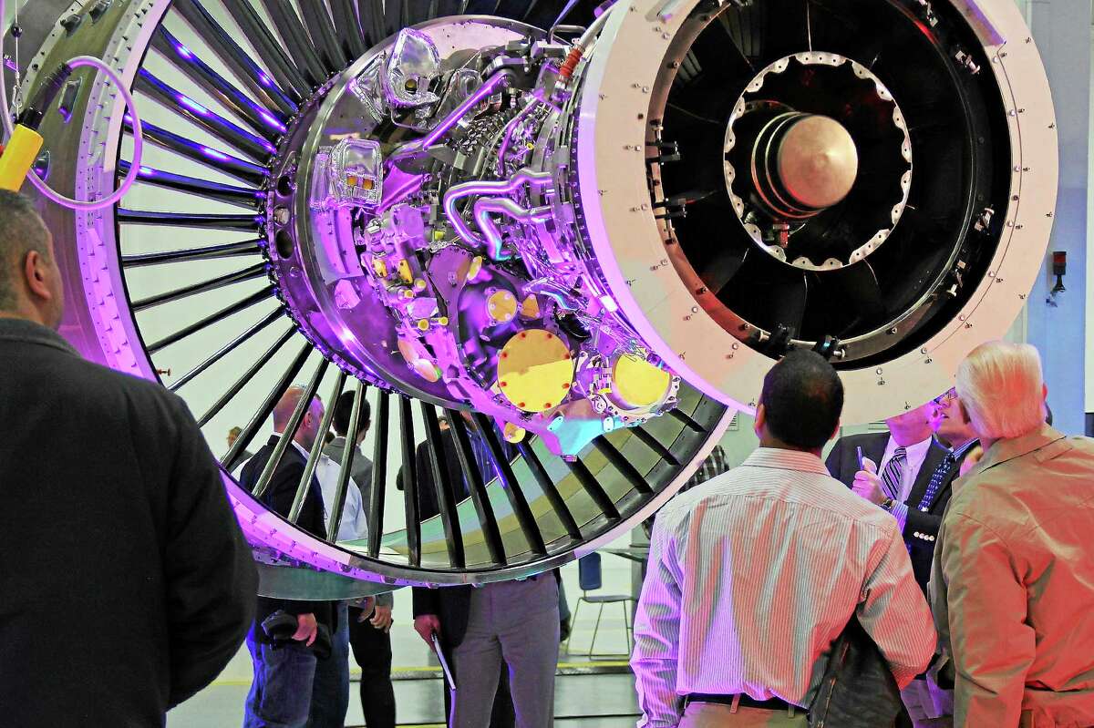 Visitors admire the beauty of the Pratt & Whitney PurePower PW1100G-JM engine for the Airbus A320neo at a 2015 ribbon-cutting in Middletown.