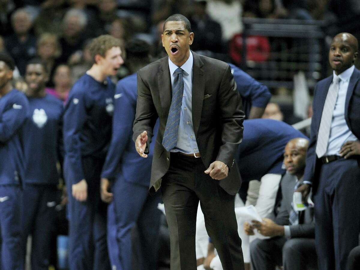 Connecticut head coach Kevin Ollie reacts in the second half of an NCAA college basketball game against Northeastern, Monday, Nov. 14, 2016, in Storrs, Conn. (AP Photo/Jessica Hill)