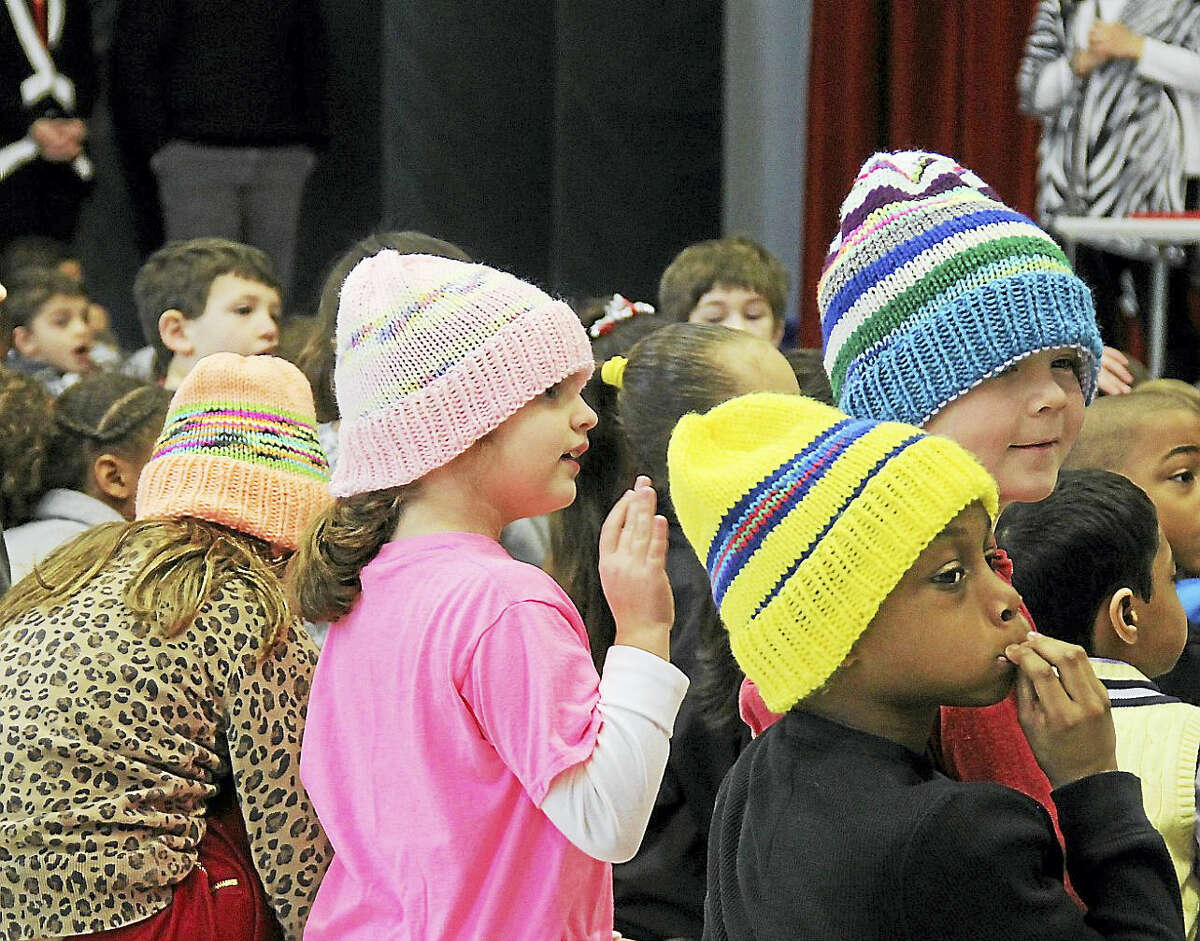 From left, students Gianna Salafia, Olivia Roy, Devin Morris and Isaiah Anderson don their colorful hats.