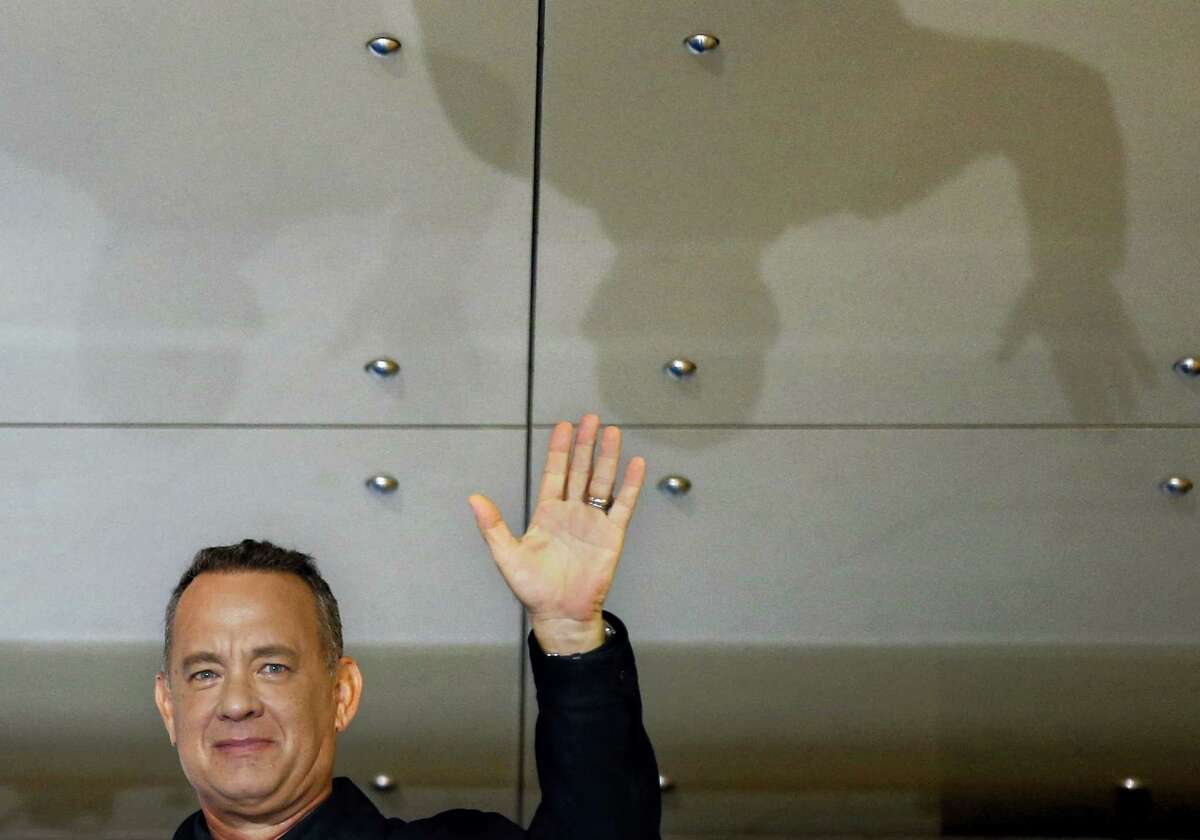 Tom Hanks waves for fans during the Japan premiere of “Sully” in Tokyo on Sept. 15, 2016.