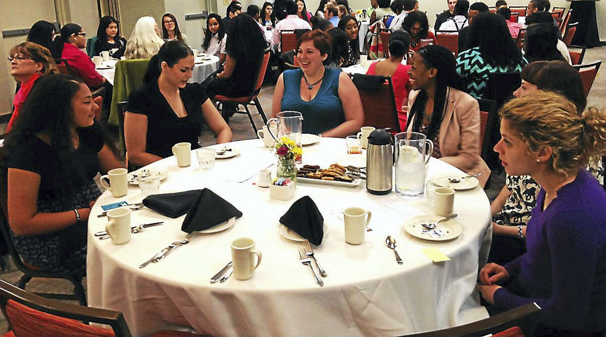 From left are Gabriela Montanez, a ninth grader at Middletown High School; and Wesleyan University seniors Shelby Harper, Trinithas Boyi, Jennifer Cummings and Elizabeth Paquette at the etiquette luncheon at the Marriott in Cromwell.