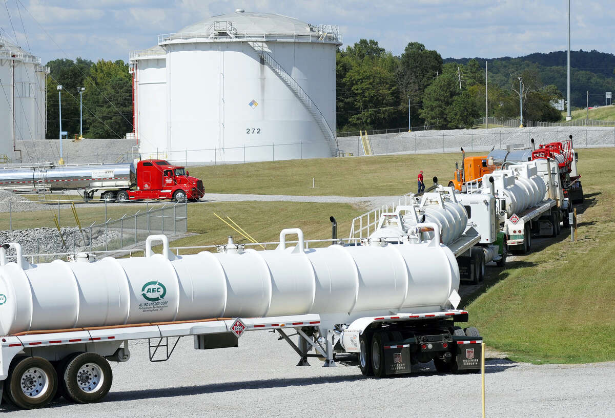 Tanker trucks line up at a Colonial Pipeline Co. facility in Pelham, Ala., near the scene of a 250,000-gallon gasoline spill on Friday, Sept. 16, 2016. The company says spilled gasoline is being taken to the storage facility for storage. Some motorists could pay a little more for gasoline in coming days because of delivery delays.