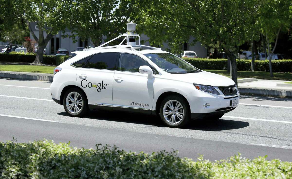 In this May 13, 2014 photo, a Google self-driving car goes on a test drive near the Computer History Museum in Mountain View, Calif. Self-driving cars are expected to usher in a new era of mobility, safety and convenience. The problem, say transportation researchers, is that people will use them too much.