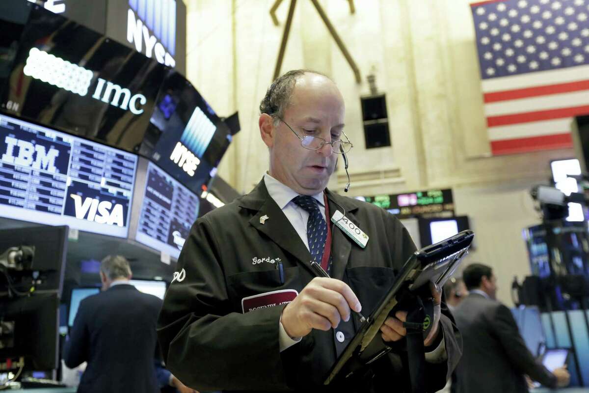 Trader Gordon Charlop works on the floor of the New York Stock Exchange Monday.