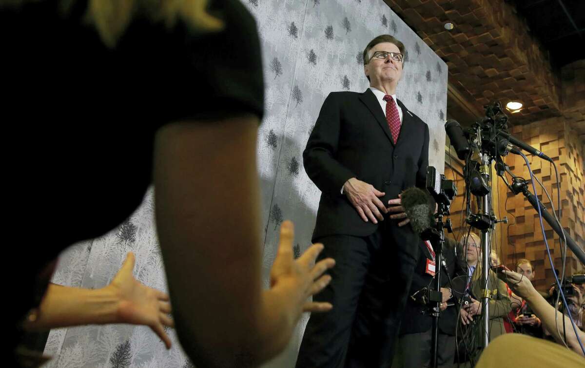 Texas Lt. Gov. Dan Patrick, right, listens to a reporter’s question during a news conference at the Texas Republican Convention Friday, May 13, 2016, in Dallas. Texas is signaling the state will challenge an Obama administrative directive over bathroom access for transgender students in public schools.