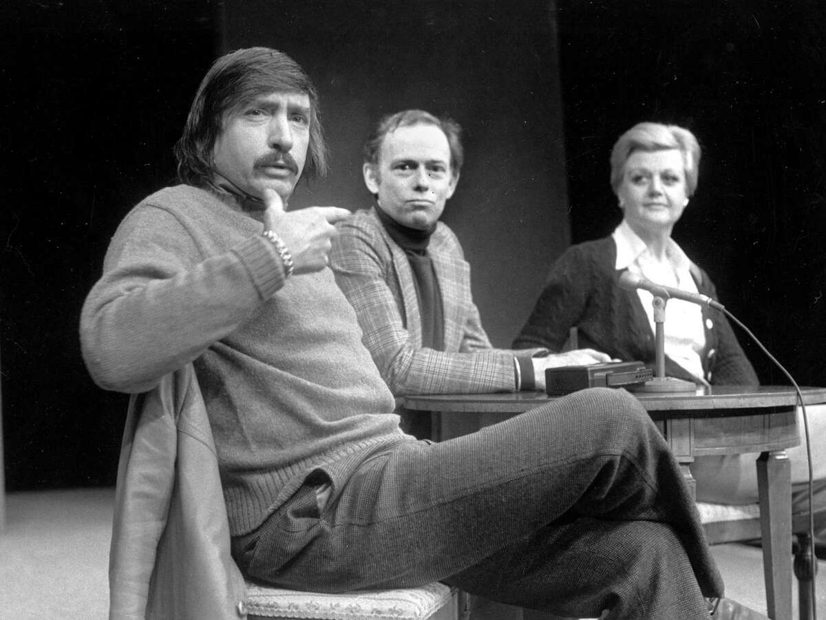 Playwright Edward Albee, left, makes a point as director Paul Weidner, center, and actress Angela Lansbury look on during a news conference in Hartford, Conn.