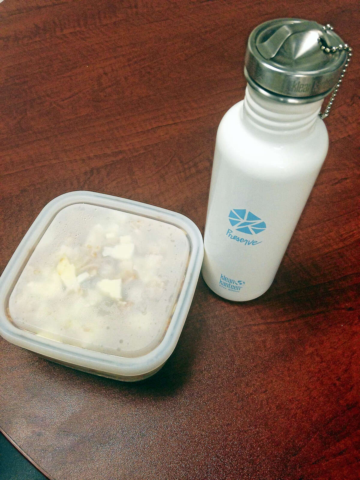 Packing my lunch in tupperware instead of plastic bags helps eliminate waste. On today's menu is leftover pasta in a microwave-safe glass tupperware. A reusable water bottle also helps eliminate waste in my life. (Anna Bisaro - New Haven Register)