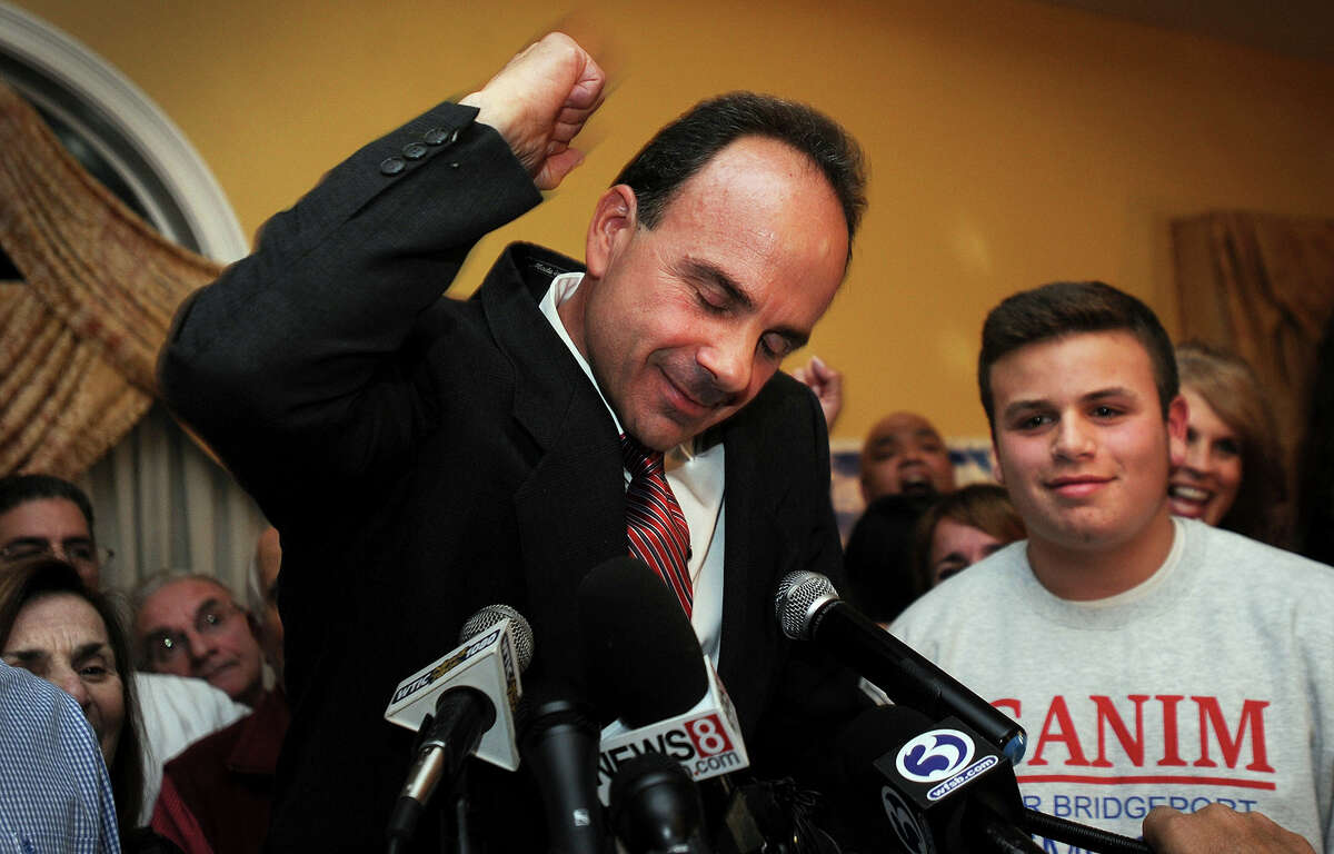 Democrat Joe Ganim celebrates with his son Rob and other supporters after winning the election as Bridgeport’s new mayor, Tuesday, Nov. 3, 2015.