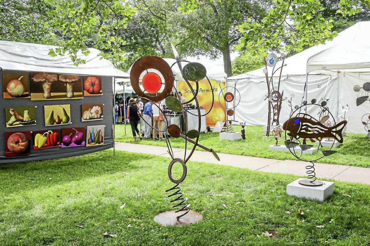 Art on the Guilford Green and the white tents are a sign the Guilford Art Center Craft Expo is here. It starts this weekend.